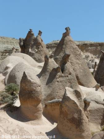 Volcanic rock fairy chimneys in Cappadocia under a blue sky