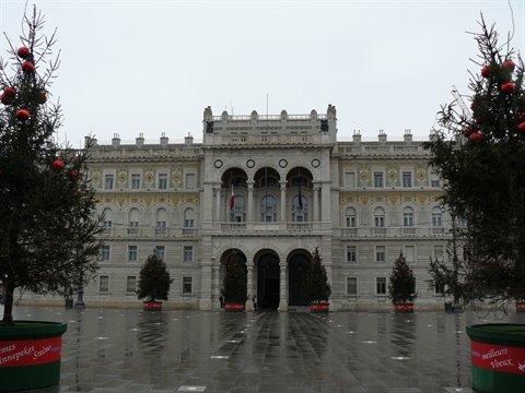 Government Palace on Piazza Unità in Trieste, rainy day with Christmas trees