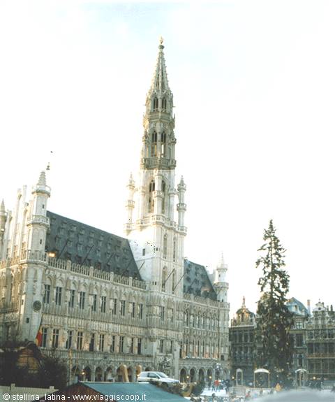 Gothic town hall tower on Brussels Grand-Place, Christmas trees and market stalls