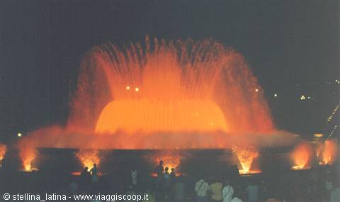 Montjuïc fountain in Barcelona, orange illuminated water jets at night