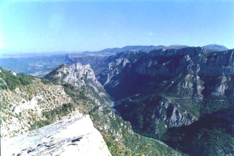 Rocky Verdon gorge with winding river and mountains under blue sky