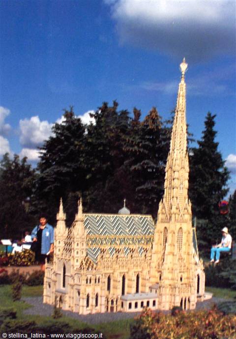 Miniature model of St. Stephen's Cathedral with zigzag roof among fir trees