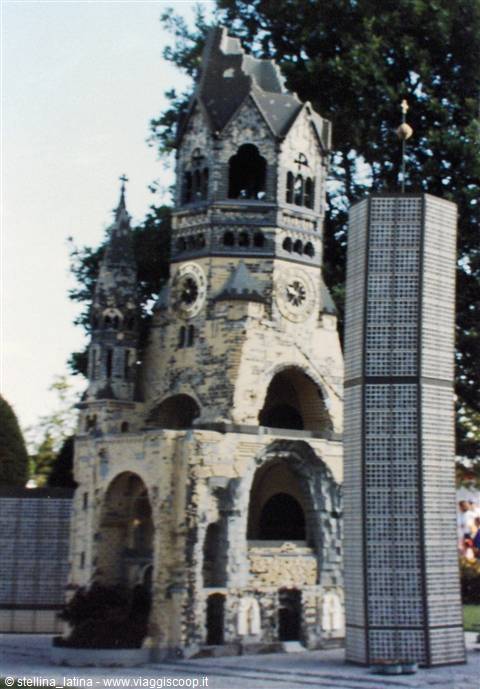 Scale model of Berlin's Gedächtniskirche in light stone, beside the glass tower