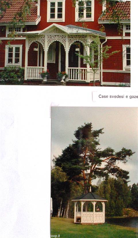 Red wooden house with carved white veranda and white gazebo in the garden