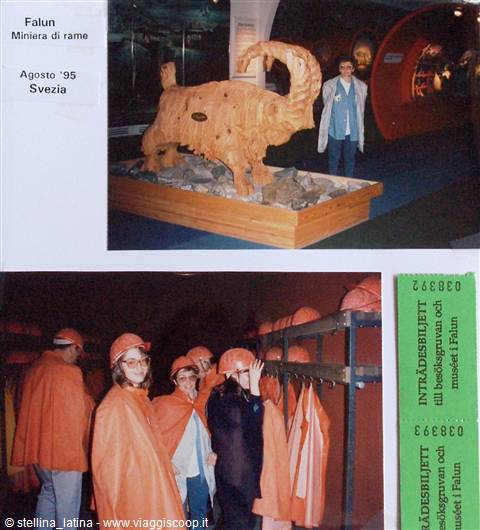 Falun copper mine museum: wooden goat sculpture and visitors in orange capes