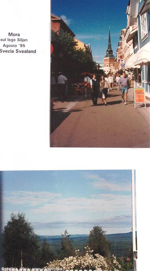 Mora, pedestrian street with people strolling and the church tower