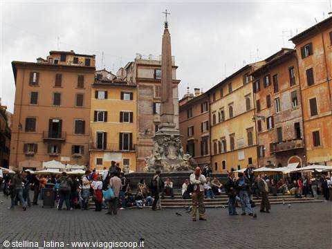 Tourists crowd the baroque fountain in front of the Pantheon in Rome
