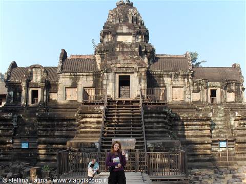 Woman at the stone staircase of Baphuon temple, Angkor