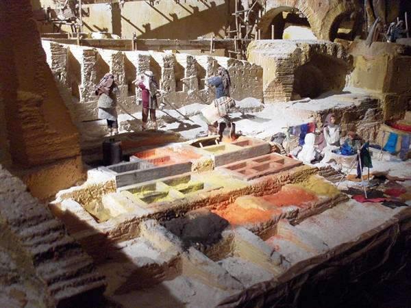 Diorama of Fes tannery: colorful dyeing vats and miniature workers