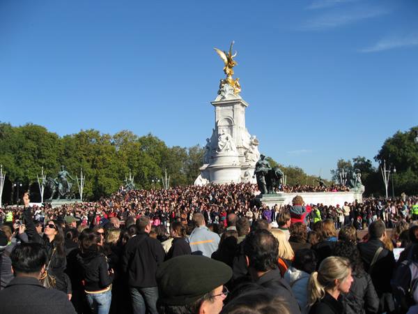 Crowd gathered at the Victoria Memorial outside Buckingham Palace, blue sky