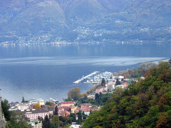 Locarno on Lake Maggiore: marina with boats among buildings and mountains