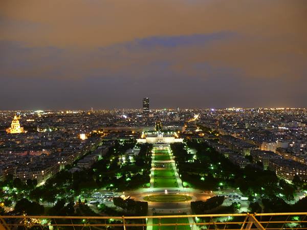 Night over Paris: the illuminated Champ de Mars seen from the Eiffel Tower