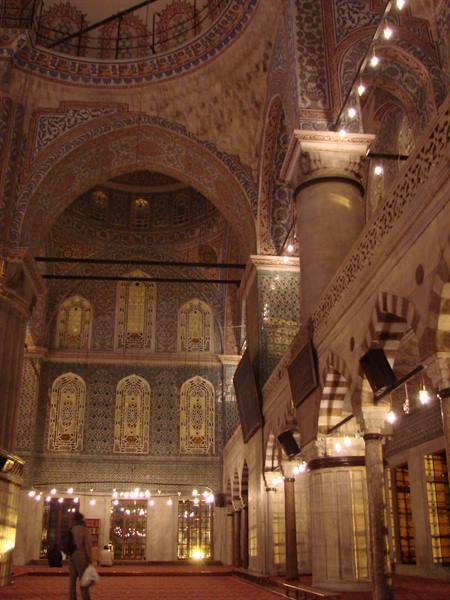 Inside Istanbul's Blue Mosque, Iznik tiles and glowing lamps