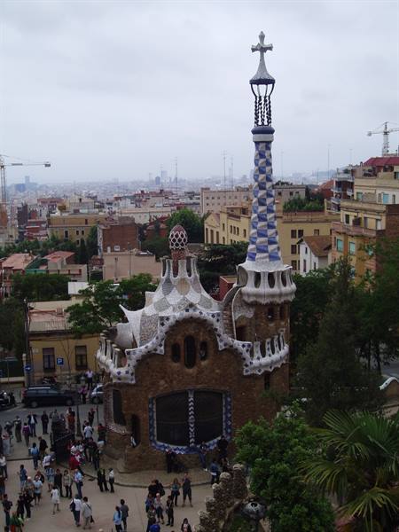 Gaudí's mosaic gatehouse with checkered spire at Parc Güell, Barcelona
