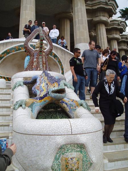 Tourists on the staircase with the mosaic salamander at Gaudí's Park Güell