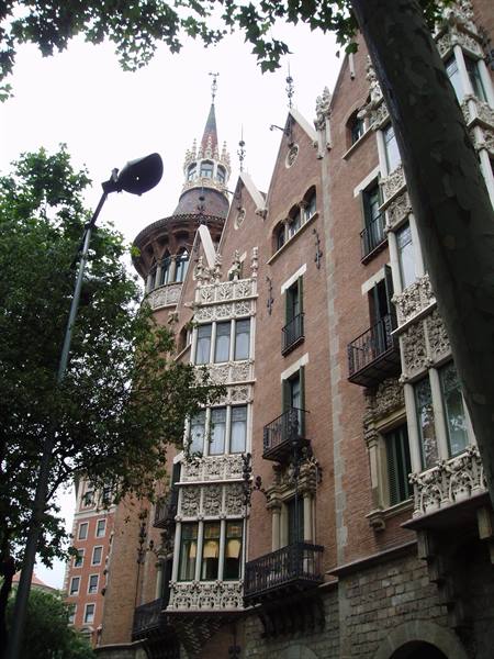 Casa de les Punxes in Barcelona, brick modernist spires among plane trees