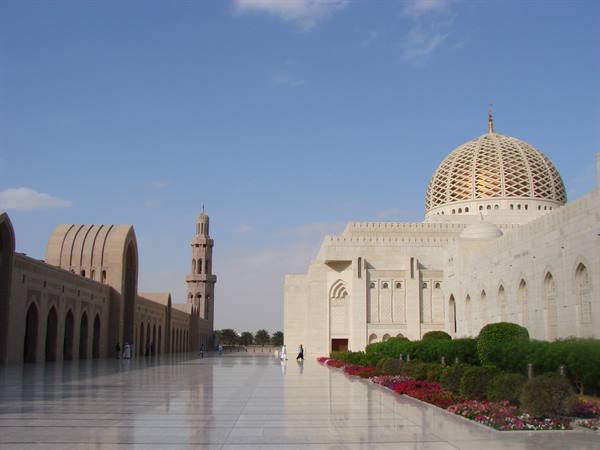 Marble courtyard of Sultan Qaboos Grand Mosque in Muscat, dome and minaret