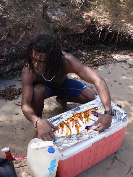 Roland preparing the fish caught by Andrea
