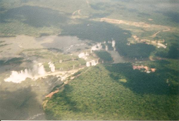 Iguazu Falls seen from the airplane among green rainforest