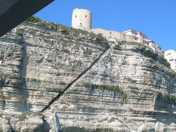 King of Aragon Staircase carved in cliff, tower and houses atop Bonifacio