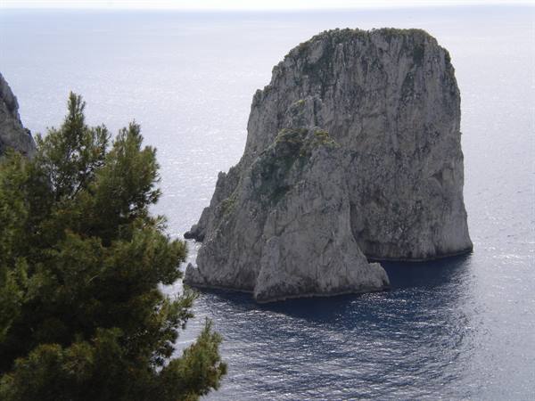 The Faraglioni rocks of Capri rising from the blue sea