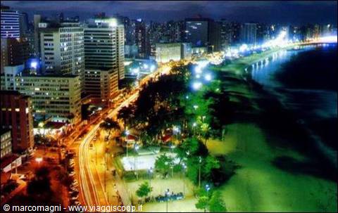 Illuminated skyscrapers and traffic along the night beachfront of Copacabana