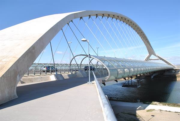 Calatrava's Lusitania Bridge in Mérida, white steel arch over the river