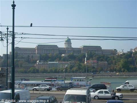 Buda Castle above the Danube, traffic and trams in foreground