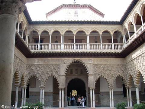 Courtyard with carved arches and columns in Seville's Real Alcázar