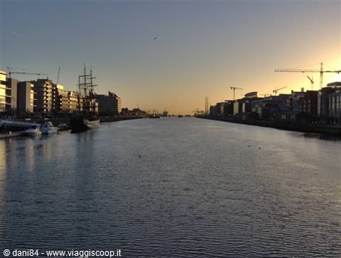 Dublin Docklands at dawn: tall ship moored along the River Liffey