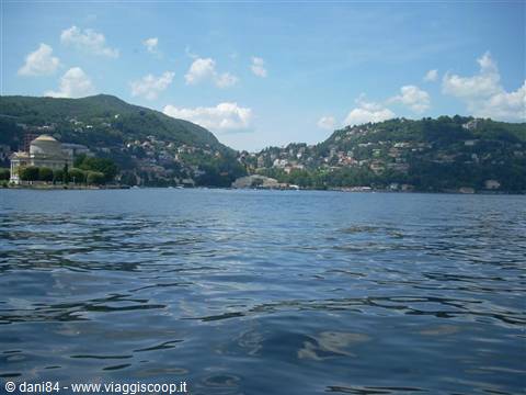 Lake Como, rippling blue water in front of Volta Temple and green hills