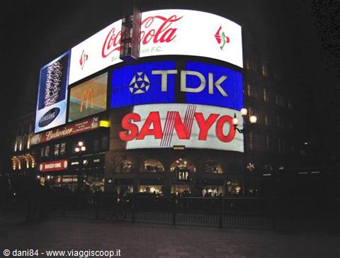 Coca-Cola, TDK and Sanyo neon billboards glowing at night, Piccadilly Circus