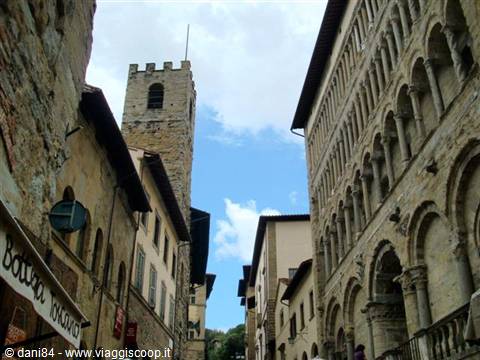 Medieval stone tower beside Santa Maria della Pieve church in Arezzo