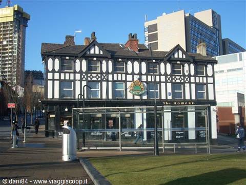 The Howard pub, half-timbered Tudor building under a clear blue sky