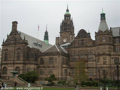 Sheffield Town Hall, stone facade with clock tower under grey sky