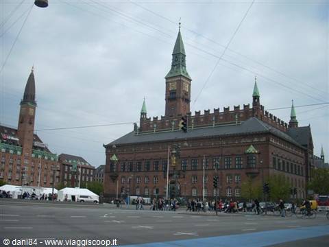 Copenhagen City Hall in red brick under cloudy sky
