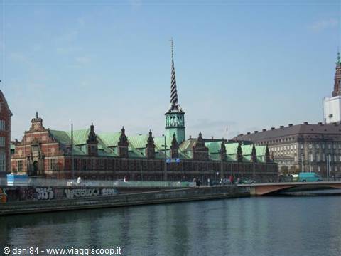Copenhagen's old Stock Exchange with its twisted spire reflects in the canal
