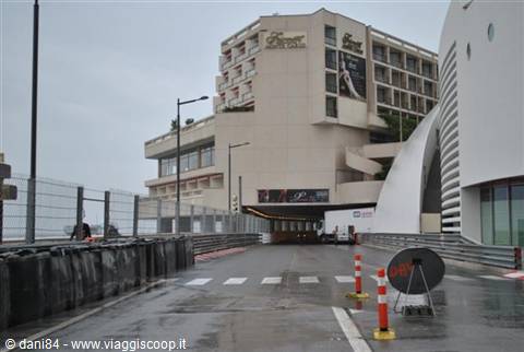 Monaco Grand Prix hairpin bend in front of the Fairmont hotel, wet asphalt