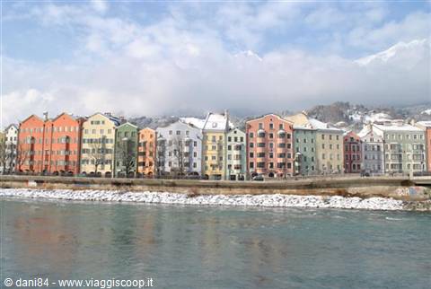 Colorful houses along the snowy Inn river, Innsbruck