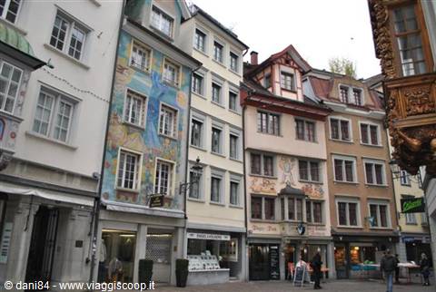 Frescoed medieval buildings in St. Gallen square, gray daylight