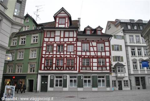 Red and green half-timbered houses in the old town square of St. Gallen