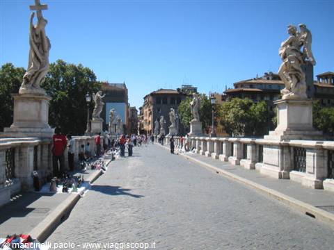 Ponte Sant'Angelo in Rome, marble statues and tourists under the sun
