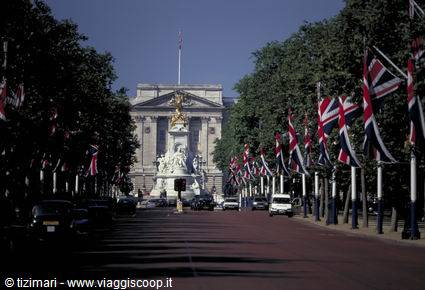 Buckingham Palace with Victoria Memorial, Union Jack flags along The Mall