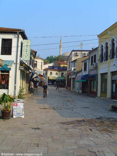Cobbled street in Skopje old bazaar with minaret and mosque in background
