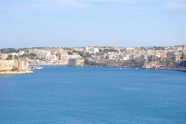 Turquoise waters of the Grand Harbour among Malta's limestone fortifications