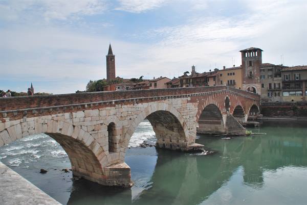 The brick and stone Ponte Pietra crossing the Adige river in Verona