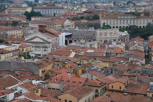 Verona's Roman Arena among terracotta rooftops beside the Gran Guardia palace