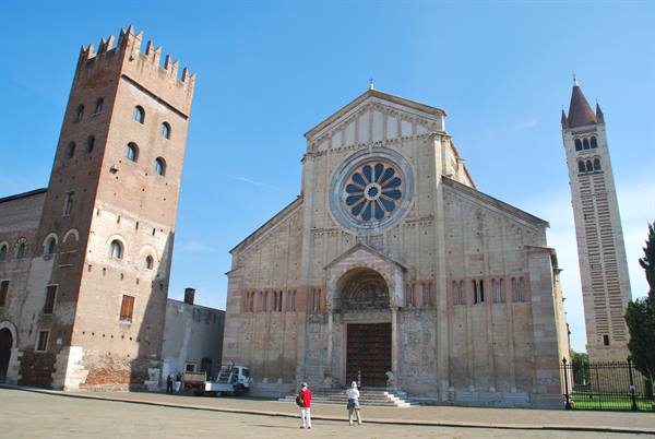 Romanesque facade of San Zeno Basilica in Verona with rose window and tower