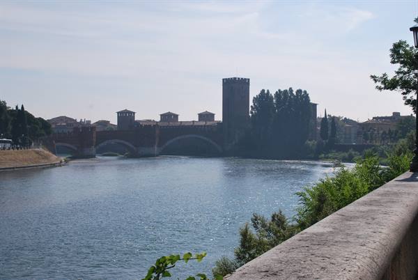 The brick Scaligero Bridge crosses the Adige river in Verona
