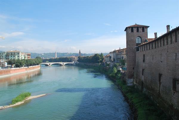 The Adige river beside Castelvecchio walls in Verona, morning light